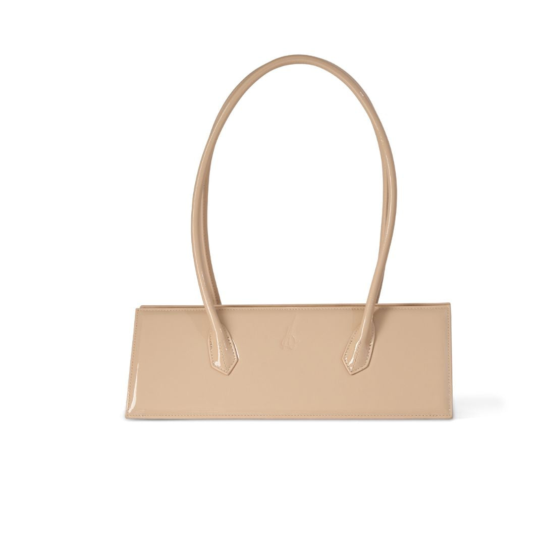 Alessia nude patent handbag with a red interior